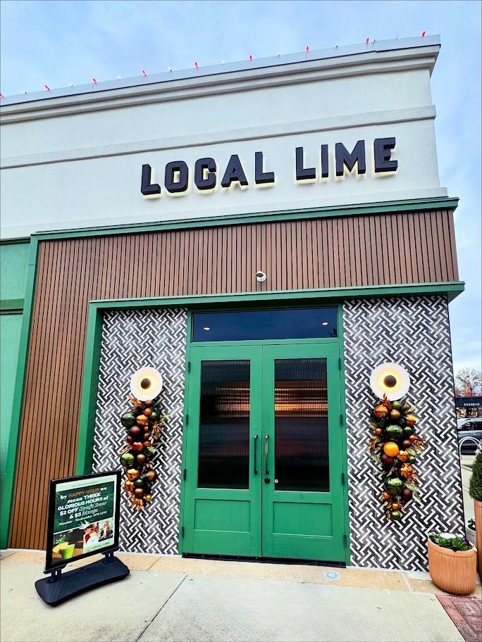 Local Lime storefront with holiday door swags